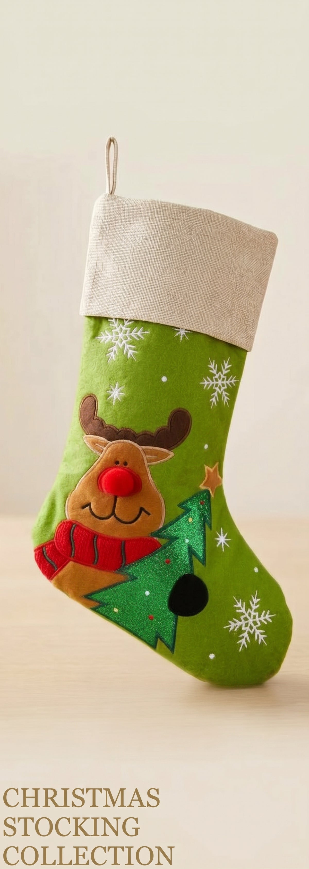Green Christmas stocking with reindeer design and snowflake pattern