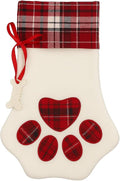 Cream plush paw-shaped Christmas stocking with red tartan plaid cuff and paw print applique