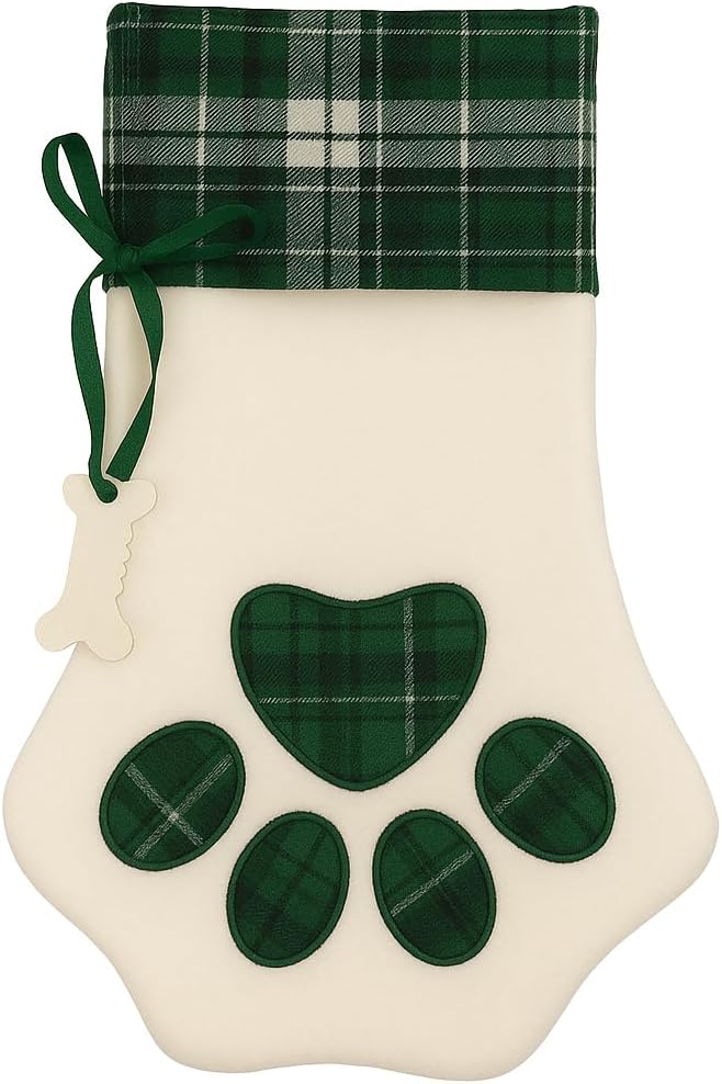 Cream plush paw-shaped Christmas stocking with green tartan plaid cuff and paw print applique